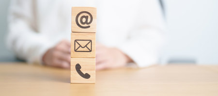 Contact Us concepts. Wood block of Email, call Phone and Website Address sign. For Customer support hotline, business Marketing, Corporate, communication and Advertisingの写真素材