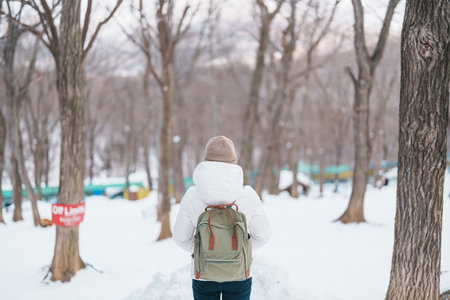Woman tourist with snow in winter season at Zao fox village, traveler sightseeing Miyagi prefecture....