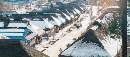 Ouchi Juku ancient farmer house village with snow in winter, former post town along the Aizu-Nishi Kaido trade route during the Edo Period. Shimogo town, Minamiaizu, Fukushima Prefecture, Japanの写真素材
