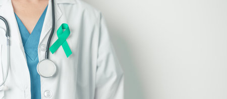 Doctor holding Teal Ribbon for January Cervical Cancer Awareness month. Uterus and Ovaries, Cervix,...