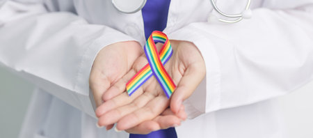 Doctor with LGBTQ Rainbow ribbon for Support Lesbian, Gay, Bisexual, Transgender and Queer community and happy Pride month conceptの写真素材