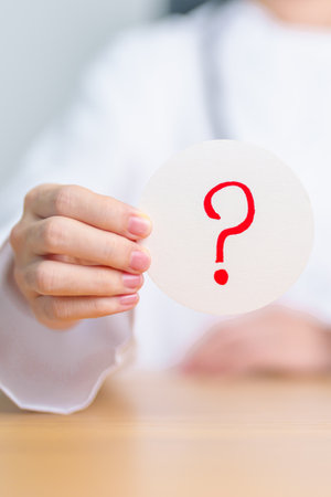 Doctor show Questions Mark ( ? ) on paper. FAQ, frequency asked questions, Answer, Information,...