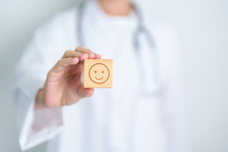 Doctor show Happy smile face block, Mental health Assessment, Psychology, Health Wellness, Positive Feedback, Customer Review, Good Experience, Satisfaction Survey, World Mental Health day conceptの写真素材