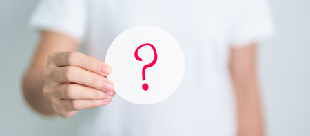Woman show Questions Mark ( ? ) on paper. FAQ, frequency asked questions, Answer, Q and A,...