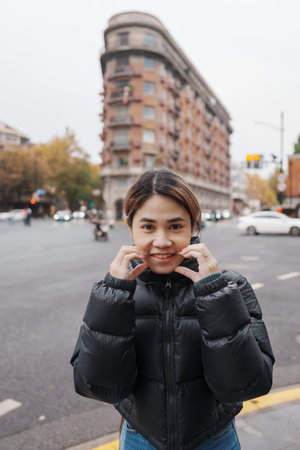 woman traveler visiting in Shanghai, China. Female Tourist with backpack sightseeing Wukang Mansion...