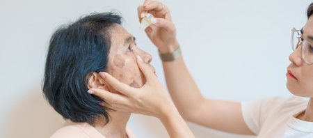 Elderly Woman use ophthalmic solutions or Eye Drops after eye surgery. Eye disease, Cataract,  Glaucoma, Age Related Macular Degeneration, Diabetic Retinopathy, World Glaucoma day and health treatmentの写真素材
