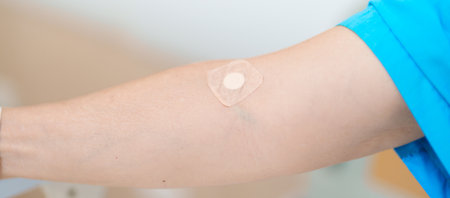 Elderly asian Patient Woman with medical patch plaster after blood test in hospital. Diagnose,...