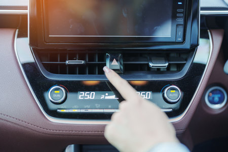 Finger presses the emergency stop button inside the car. Safety and transportation concept