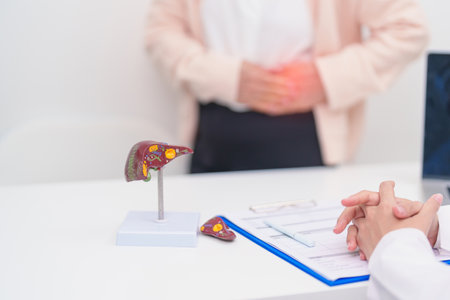 Doctor with human Liver anatomy. Elderly Patient consultation medical health for Liver cancer and Tumor, Jaundice, Viral Hepatitis, Cirrhosis, Failure, Enlarged, Hepatic Encephalopathy, Ascites Fluidの写真素材