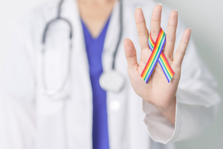 Doctor with LGBTQ Rainbow ribbon for Support Lesbian, Gay, Bisexual, Transgender and Queer community and happy Pride month conceptの写真素材