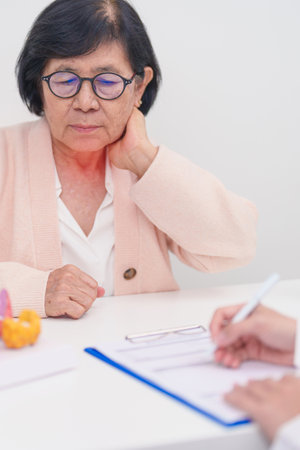 Elderly Patient having Neck pain and consulting  with Doctor to Thyroid disease. Anatomy Thyroid...