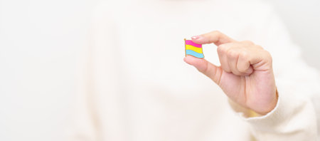 Pansexual Visibility Day and Panromantic May Awareness Day and LGBT pride month concept. hand holding pink, yellow and blue heart shape for Lesbian, Gay, Bisexual, Transgender and Marriage Equalityの写真素材