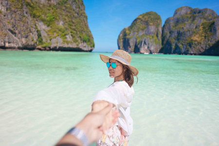 Couple tourist traveling and sightseeing in Krabi, Thailand. happy traveller enjoy at Maya Bay beach...