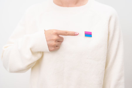 Bisexuality Celebrate Day and LGBT pride month, LGBTQ or LGBTQIA concept. Hand holding purple, pink and blue flag shape for Lesbian, Gay, Bisexual, Transgender, Queer, Pansexual, Marriage Equality Lawの写真素材