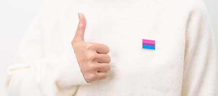 Bisexuality Celebrate Day and LGBT pride month, LGBTQ or LGBTQIA concept. Hand holding purple, pink and blue flag shape for Lesbian, Gay, Bisexual, Transgender, Queer, Pansexual, Marriage Equality Lawの写真素材