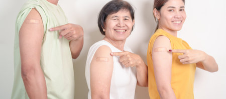 Adult and Senior group with bandage after received vaccine. Vaccination and Immunization for Influenza, HPV, Zoster, IPD, DTP, Dengue, Encephalitis, Rabies, Pneumococcal Hepatitis B and Covid vaccinesの写真素材