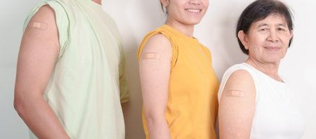 Adult and Senior group with bandage after received vaccine. Vaccination and Immunization for Influenza, HPV, Zoster, IPD, DTP, Dengue, Encephalitis, Rabies, Pneumococcal Hepatitis B and Covid vaccinesの写真素材