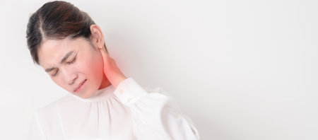 Business Woman having Neck pain for concepts of Neck Muscle Strain and Inflammation, Myofascial pain syndrome and Fibromyalgia, Rheumatism, Cervical Spine Spondylosis, Office Syndrome and Ergonomicの写真素材