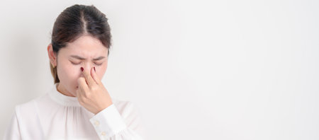 Business Woman having Nose pain for concepts of Nose disease, Common Cold, Influenza, Flu, Covid 19,...