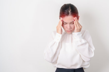 Business Woman having headache and Dizzy for concepts of Chronic Stress, Headache and Migraine, World Brain Tumor day, Brain Cancer, Brain Stroke, Dementia, alzheimer, Hypotension and mental healthの写真素材