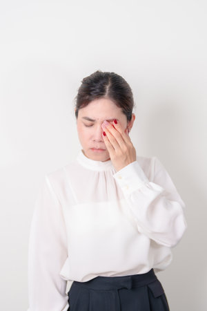 Business Woman having Eye pain and Irritation for concepts of Eye disease, Cataract, Glaucoma, Age Related Macular Degeneration, Diabetic Retinopathy, dry eyes, Conjunctivitis, World Glaucoma dayの写真素材