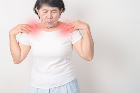 Elderly Woman having Shoulder Pain for Muscle Inflammation and Sprain, Myofascial ache syndrome and Fibromyalgia, Shoulder Myalgia, Scapular Tightness, Cervical Spine, Rheumatism and Health careの写真素材