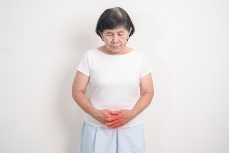 Elderly woman having Bladder pain for concepts of Bladder disease, Cancer Awareness Month May, Cystitis, Bladder Stone, urinary tract infection, UTI, Urethritis, Pyelonephritis, Urinary incontinenceの写真素材