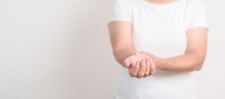 Elderly  Woman having wrist pain for Carpal Tunnel Syndrome, Wrist Tendinitis, muscle ache, De Quervain s tenosynovitis, Hand Osteoarthritis, Parkinson disease and Senior health care conceptの写真素材