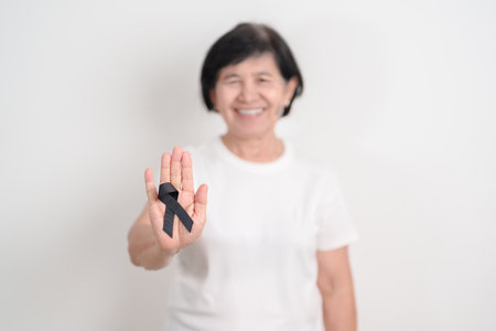Elderly with Black ribbon for May Melanoma and skin cancer Awareness month, October Vaccine injury...