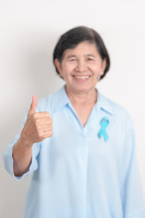 Elderly with blue Ribbon for Prostate Cancer Awareness month, April Child Abuse Prevention, National...