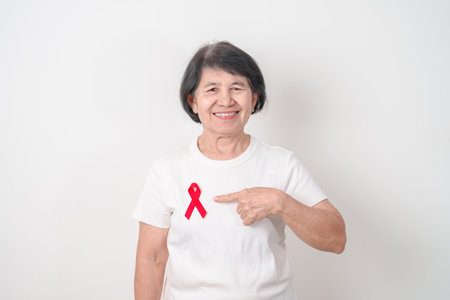Elderly with Red Ribbon for December World Aids Day, October Red ribbon week, February Heart month,...