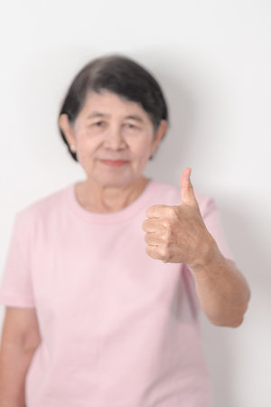 Elderly woman with pink Shirt for Pink October Breast Cancer Awareness month, women rights,...