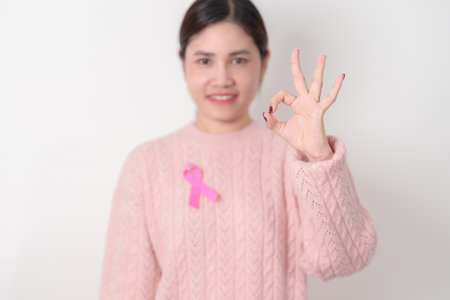 Pink October Breast Cancer Awareness month, woman with pink Ribbon for concepts of support people life and illness. National cancer survivors month, Women Health day and February World cancer dayの写真素材