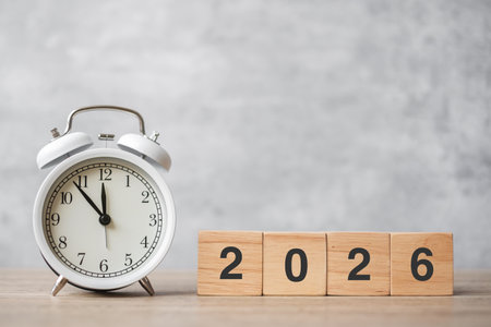 Happy New Year with vintage alarm clock and 2026  block. Christmas, New Start, Resolution,...