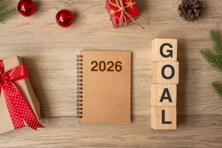 2026 New Year with notebook, Christmas gift and pen on wood table. Xmas, Happy New Year, Goals, Resolution, To do list, start, Strategy and Plan conceptの写真素材