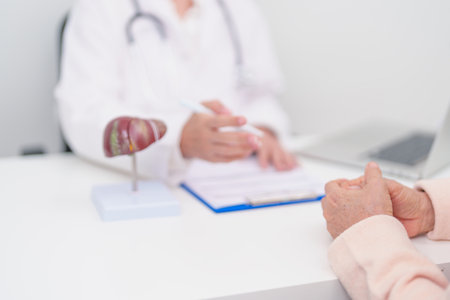 Doctor with human Liver anatomy. Elderly Patient consultation medical health for Liver cancer and Tumor, Jaundice, Viral Hepatitis, Cirrhosis, Failure, Enlarged, Hepatic Encephalopathy, Ascites Fluidの写真素材