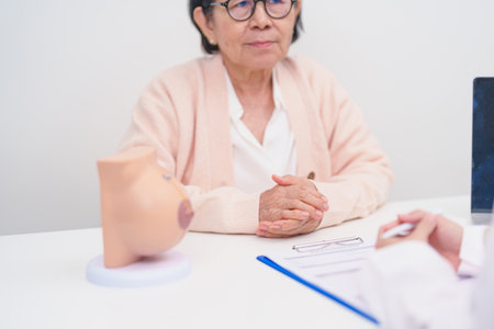 Elderly woman Patient consultation with doctor for Breast Augmentation Surgery, October Breast Cancer Awareness month, implant, Diagnosis, Beauty woman enlargement and medical healthcare conceptの写真素材