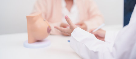 Elderly woman Patient consultation with doctor for Breast Augmentation Surgery, October Breast Cancer Awareness month, implant, Diagnosis, Beauty woman enlargement and medical healthcare conceptの写真素材
