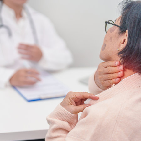 Elderly Woman having Shoulder and Neck and consulting doctor in hospital. Muscle painful due to...