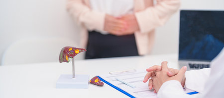 Doctor with human Liver anatomy. Elderly Patient consultation medical health for Liver cancer and Tumor, Jaundice, Viral Hepatitis, Cirrhosis, Failure, Enlarged, Hepatic Encephalopathy, Ascites Fluidの写真素材
