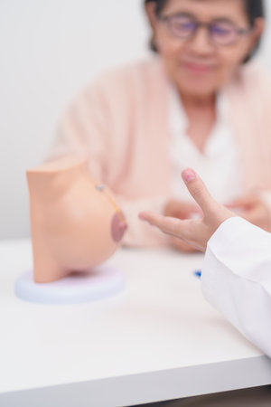 Elderly woman Patient consultation with doctor for Breast Augmentation Surgery, October Breast Cancer Awareness month, implant, Diagnosis, medical healthcare conceptの写真素材