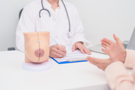 woman Patient consultation with doctor for Breast Augmentation Surgery, October Breast Cancer Awareness month, implant, Diagnosis, Beauty woman enlargement and medical healthcare conceptの写真素材