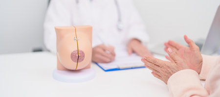 Patient consultation with doctor for Breast Augmentation Surgery, October Breast Cancer Awareness month, implant, Diagnosis, Beauty woman enlargement and medical healthcare conceptの写真素材