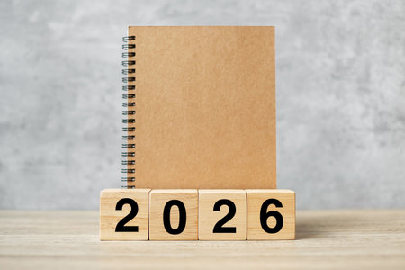 2026 Happy New Year with blank notebook and wooden number. countdown, Resolution, Goals, Plan, Action and Mission Conceptの写真素材