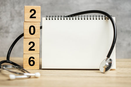 2026 Happy New Year for healthcare, Insurance, Wellness and medical concept. Stethoscope and blank notebook for copy space your textの写真素材