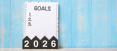 2026 Happy New Year with GOAL word and wooden number. time for a New Start, Resolution, Plan, Action...