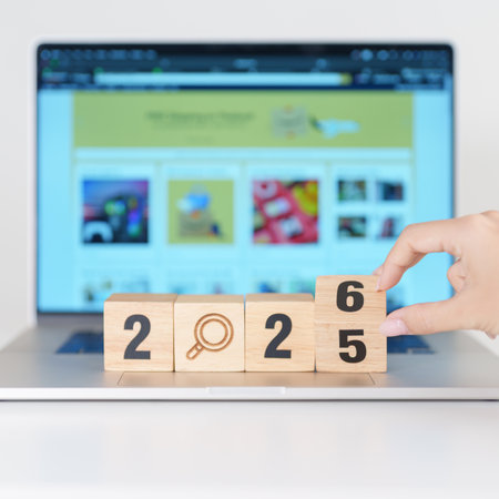 2025 end year to Happy New Year 2026 block magnifying glass icon against laptop background. Hiring, recruitment, job, jobless SEO, Search Engine Optimization and New Year conceptsの写真素材