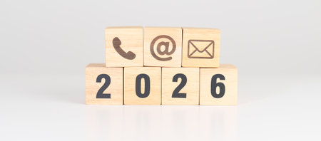 Happy New Year 2026 block for Contact Us concepts. Wood block of Email, call Phone and Website...