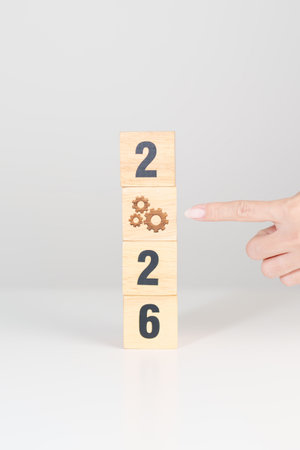 2026 year block with gear icon. Business Process, Team, teamwork, Goal, Target, Resolution, strategy, plan, Action, motivation, change, brainstorm and New Year start conceptsの写真素材