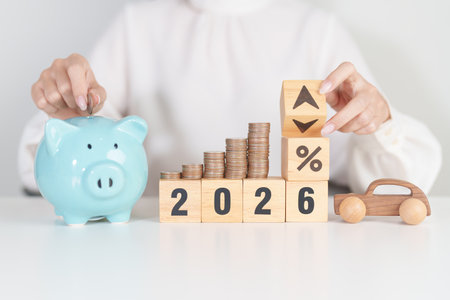 2026 New Year with percentage change to UP and Down arrow, car model and coin stack. Car loan,...